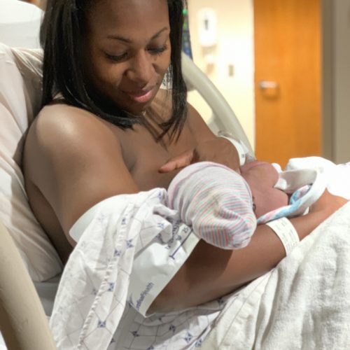 mom holding newborn moments after natural birth in hospital